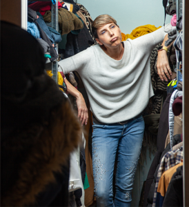 Woman in overflowing closet